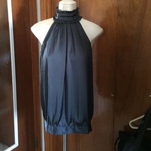 Sleeveless ruffled neck blouse