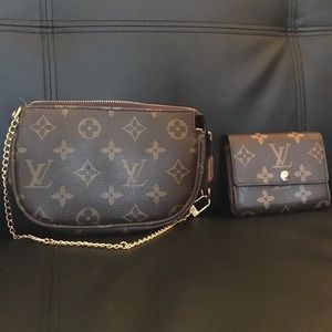 Louis Vuitton wristlet with mini wallet.