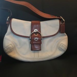 White and brown leather. Coach