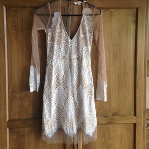 Nude lace luxxel dress sizes small.