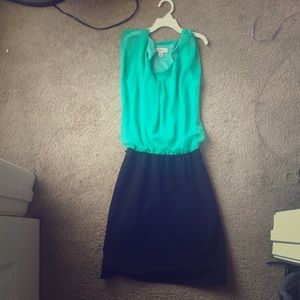 Bluish-green and black dress.