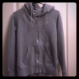 Gray Nike hooded jacket.