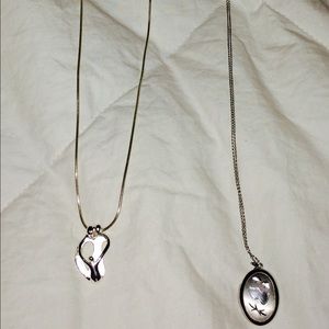 2 sterling silver necklaces.