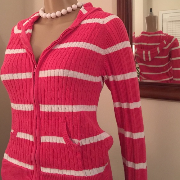 Zippered hooded cable knit cardigan.