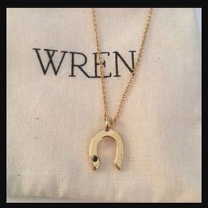 14k gold and black sapphire horseshoe necklace.