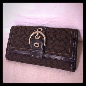 Coach Signature Checkbook wallet.