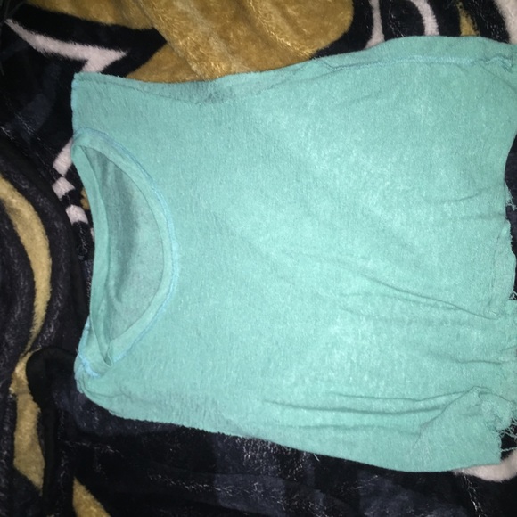 teal color distressed crop top.