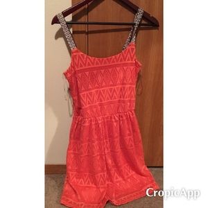 Orange tribal dress.
