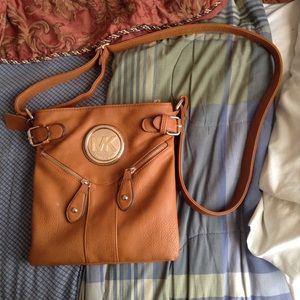 Mk cross over purse on hold til thursday