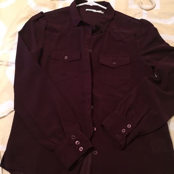 Burgundy sheer blouse.