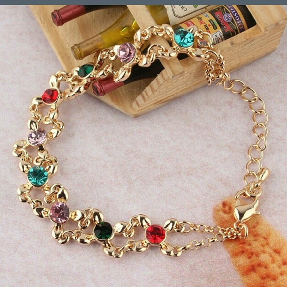 Gold Bracelet with multi-colored stones.NIP