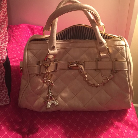 Used cream purse with Eiffel Tower charm