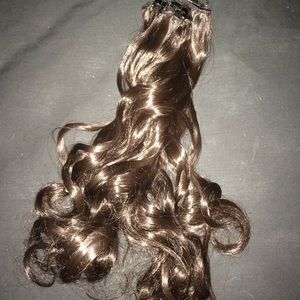 Dark brown synthetic hair extensions