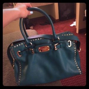 Micheal Kors teal purse very nice! Like new