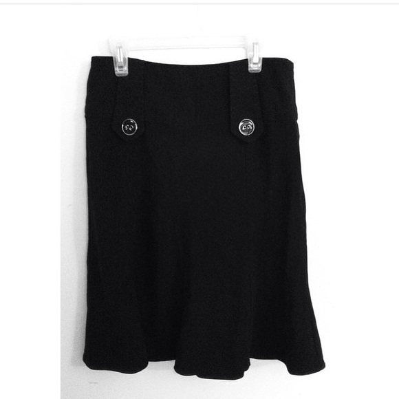 Black midi skirt with buttons.