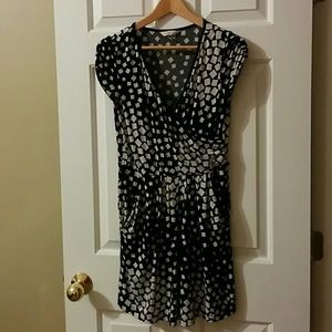 Black and tan dress with a wrap v-neck and pockets