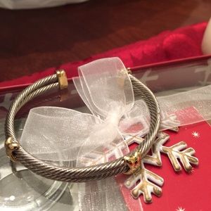 Silver bangle with gold tips
