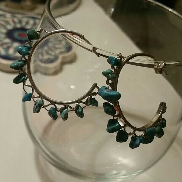 Silver and turquoise hoops.