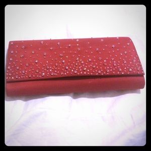 Clutch with red strap