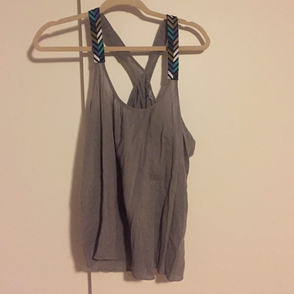 grey top with multicolored strap