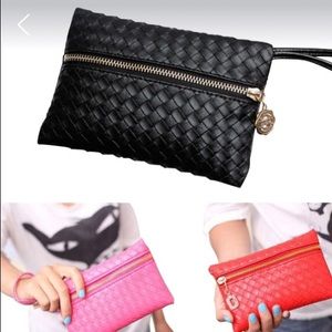Red in color wristlet/clutch