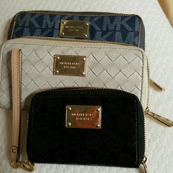3 Michael kors zipper wallets