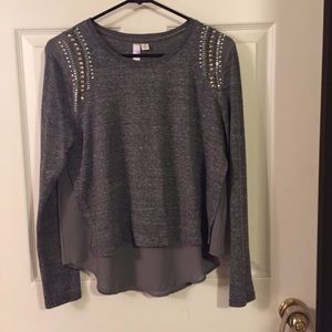 Gray studded layer shirt.