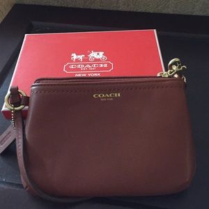 Small tan leather coach wristlet