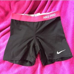 Pink Nike Pro Dri-Fit spandex shorts