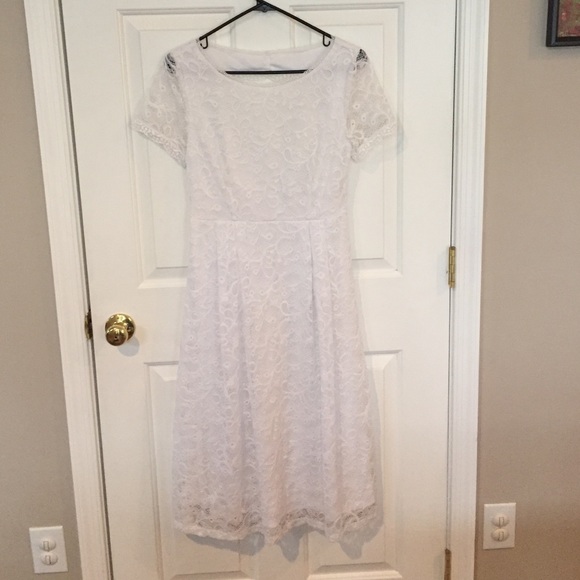 T-length white lace dress. Purchased at ModCloth