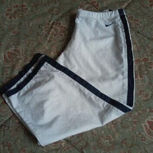 Nike white 3/4 length joggers with navy blue strip