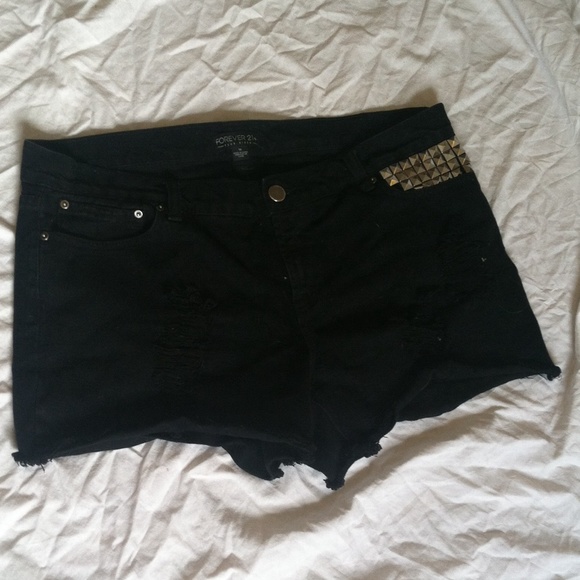 Ripped black studded jean shorts