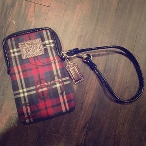Authentic coach cell phone/ credit card pocket.