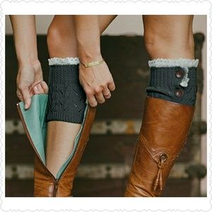 Beige boot cuffs with lace accents.