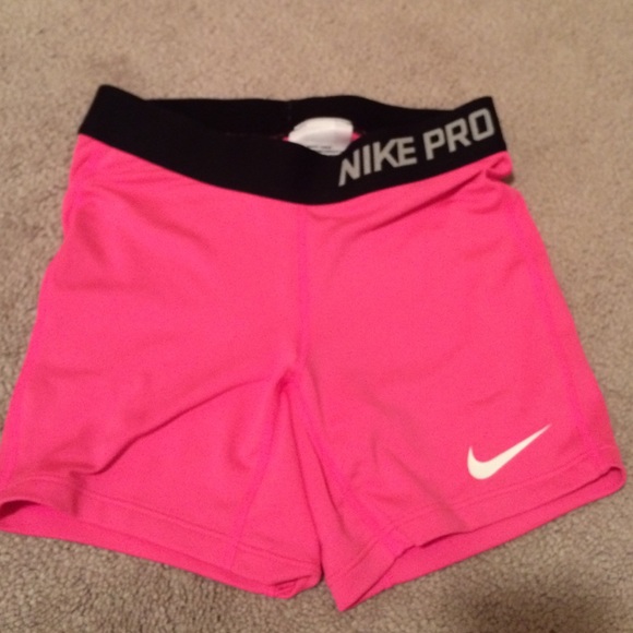 Pink and black nike pros