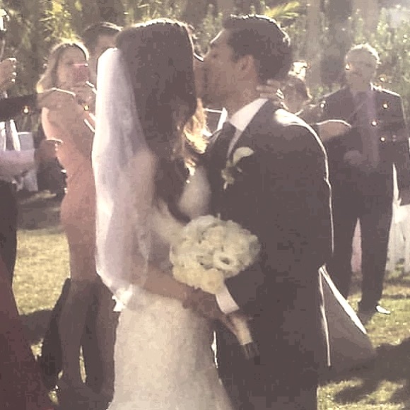 Shoulder length veil with beading around trim