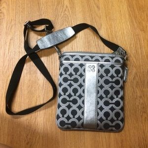 Silver/black Coach cross-body purse