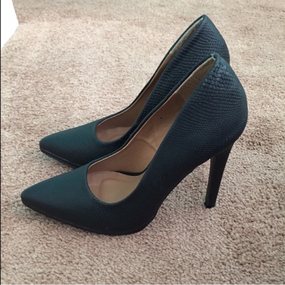 Black pointed toe pumps