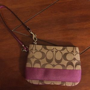 Coach wristlet with pink details