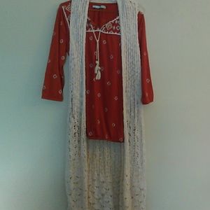 Long sleeved pattern blouse with long cream vest