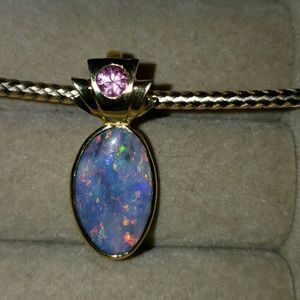 This is an amazing 10k gold Opal pendant...