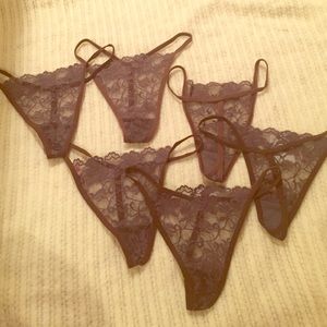 12 pairs of brand new brown lace thongs.