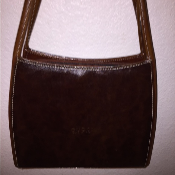 Leather brown Gucci nice with legs on bottom wear