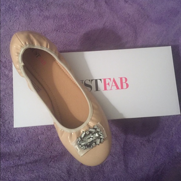 Nude flats with beautiful jewel accents on the toe