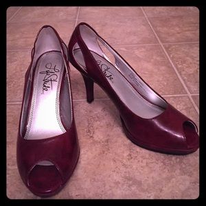 red peep-toe pumps with heel cutout