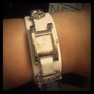 Authentic Guess watch with white leather strap.