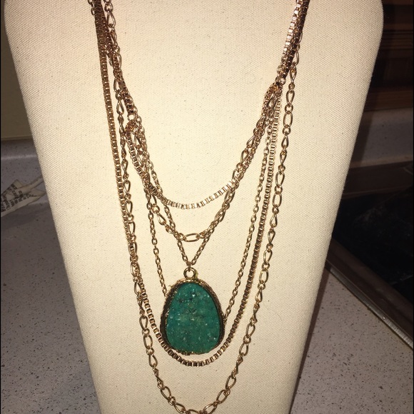 Statement necklace with teal rock.