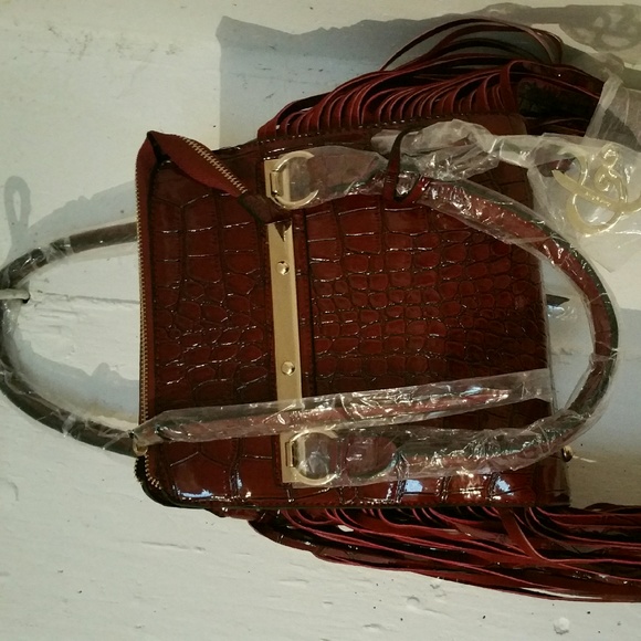 Burgundy snake skin look purse with fringes