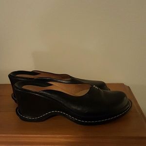 Black leather mules