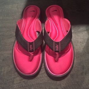 Pink nike flip flops
